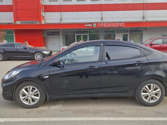 2012 Hyundai Solaris I, чёрный, 600000 рублей - вид 13