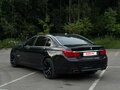 2011 BMW 7 серии 750i xDrive V (F01/F02/F04), чёрный - вид 4
