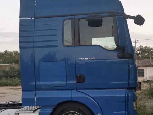 2009 MAN TGX, синий, 2600000 рублей - вид 1