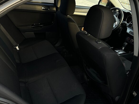2010 Mitsubishi Lancer X, чёрный, 720000 рублей - вид 12