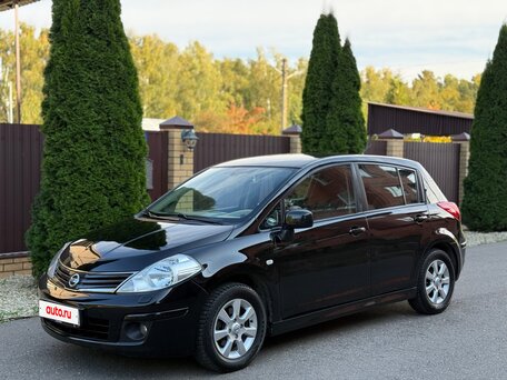 2011 Nissan Tiida I Рестайлинг, чёрный, 700000 рублей, вид 1