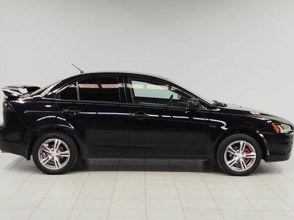 2010 Mitsubishi Lancer X, чёрный, 750000 рублей - вид 3