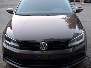 2016 Volkswagen Jetta VI Рестайлинг, коричневый, 960000 рублей, вид 1
