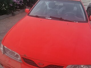 1999 Nissan Almera I (N15), красный, 129000 рублей, вид 1