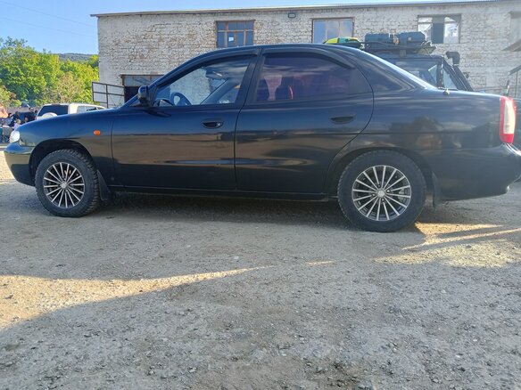 1999 Daewoo Nubira I, чёрный, 300000 рублей - вид 10