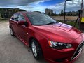 2012 Mitsubishi Lancer X Рестайлинг, красный, 1050000 рублей - вид 1