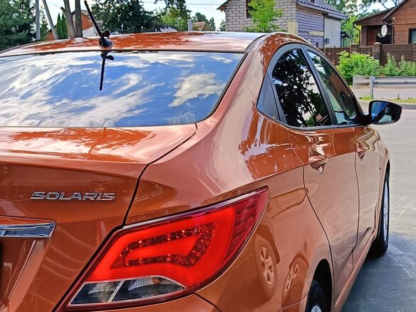 2014 Hyundai Solaris I Рестайлинг, оранжевый - вид 13