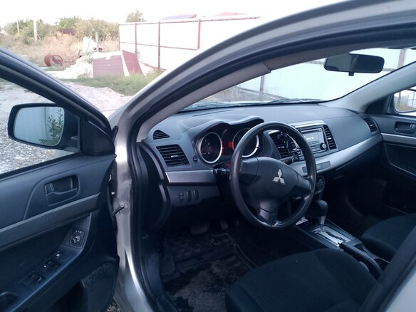 2014 Mitsubishi Lancer X Рестайлинг, серебристый, 870000 рублей - вид 11