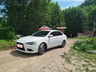 2011 Mitsubishi Lancer X Рестайлинг, белый, 900000 рублей, вид 1