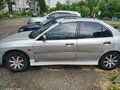 1998 Mitsubishi Mirage V, серебристый, 140000 рублей - вид 1