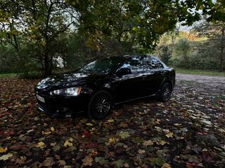 2011 Mitsubishi Lancer X Рестайлинг, чёрный, 730000 рублей, вид 1