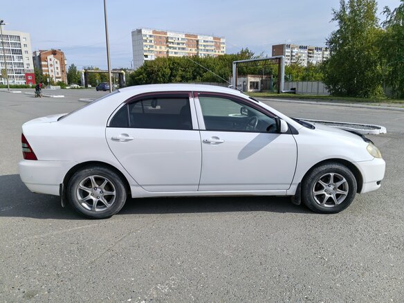 2004 Toyota Corolla IX (E120, E130), белый, 500000 рублей - вид 2