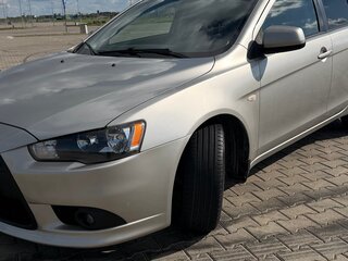 2012 Mitsubishi Lancer X Рестайлинг, серебристый, 850000 рублей, вид 2