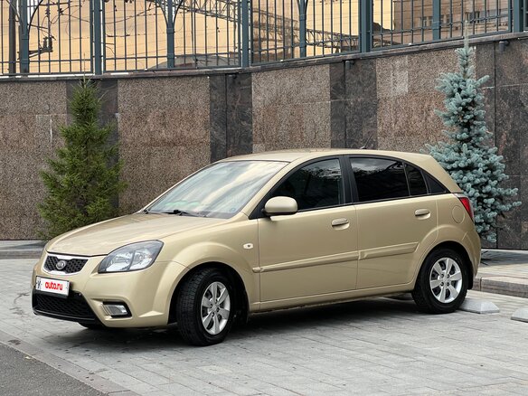2011 Kia Rio II Рестайлинг, бежевый - вид 3