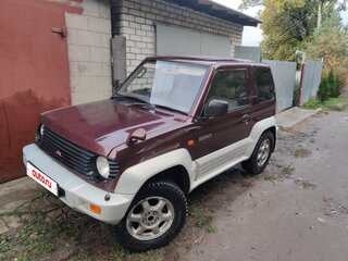 1995 Mitsubishi Pajero Junior, красный, 325000 рублей, вид 1