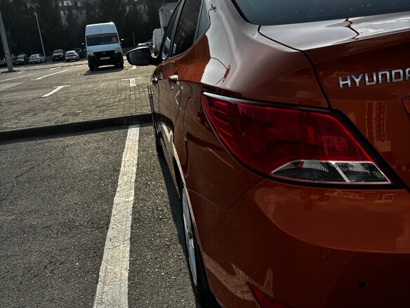 2014 Hyundai Solaris I Рестайлинг, оранжевый, 950000 рублей - вид 10