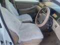 2002 Toyota Corolla IX (E120, E130), белый, 500000 рублей - вид 8
