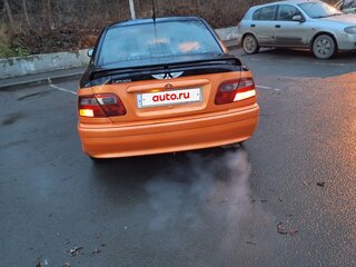 2003 Mitsubishi Carisma I Рестайлинг, оранжевый, 210000 рублей, вид 5