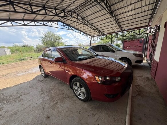 2008 Mitsubishi Lancer X, красный, 600000 рублей - вид 3