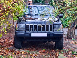 1996 Jeep Grand Cherokee I (ZJ) Рестайлинг, чёрный, 850000 рублей, вид 3