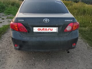 2010 Toyota Corolla X (E140, E150), чёрный, 450000 рублей, вид 4
