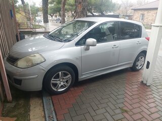 2010 Nissan Tiida I Рестайлинг, серебристый, 730000 рублей, вид 1
