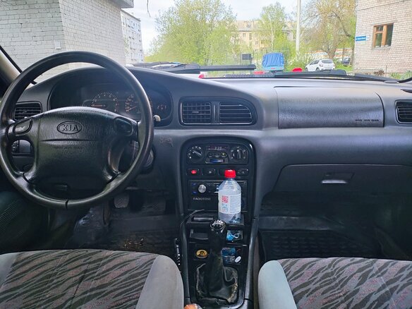 1999 Kia Clarus II, серый, 97000 рублей - вид 10