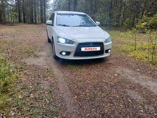 2011 Mitsubishi Lancer X Рестайлинг, белый, 640000 рублей, вид 2