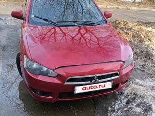 2009 Mitsubishi Lancer X, красный, 550000 рублей, вид 1