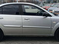 2010 Kia Rio II Рестайлинг, серебристый - вид 2