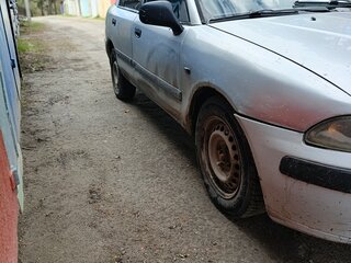 2002 Mitsubishi Carisma I Рестайлинг, серебристый, 70000 рублей, вид 3