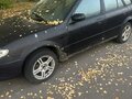 2002 Mazda 323 VI (BJ) Рестайлинг, чёрный, 120000 рублей - вид 1