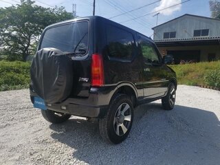 2010 Suzuki Jimny Kei car III Рестайлинг 1, чёрный, 600000 рублей, вид 4