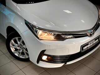 2018 Toyota Corolla XI (E160, E170, E180) Рестайлинг 1, белый, 1899000 рублей, вид 3