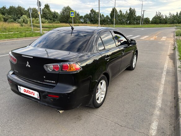 2010 Mitsubishi Lancer X, чёрный, 720000 рублей - вид 3
