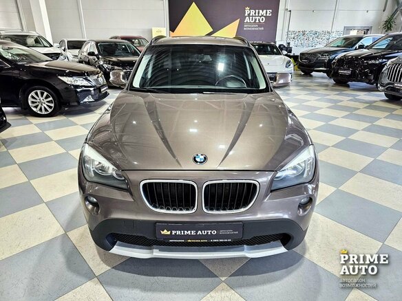 2012 BMW X1 20d I (E84), коричневый - вид 1