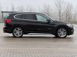2015 BMW X1 28i xDrive II (F48), чёрный, 1815209 рублей, вид 2