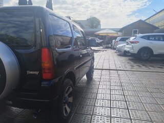 2011 Suzuki Jimny Kei car III Рестайлинг 1, чёрный, 1000000 рублей, вид 4