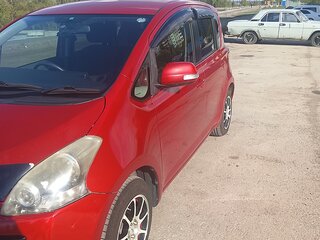 2009 Toyota Ractis I, красный, 620000 рублей, вид 4