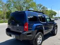 2010 Nissan Xterra II Рестайлинг, синий - вид 3