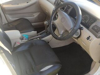 2002 Toyota Corolla IX (E120, E130), белый, 565000 рублей, вид 2