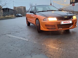 2003 Mitsubishi Carisma I Рестайлинг, оранжевый, 210000 рублей, вид 3