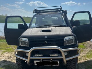 2009 Suzuki Jimny Kei car III Рестайлинг 1, чёрный, 650000 рублей, вид 1