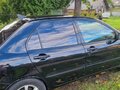 2006 Mitsubishi Lancer IX Рестайлинг, чёрный, 500000 рублей - вид 2