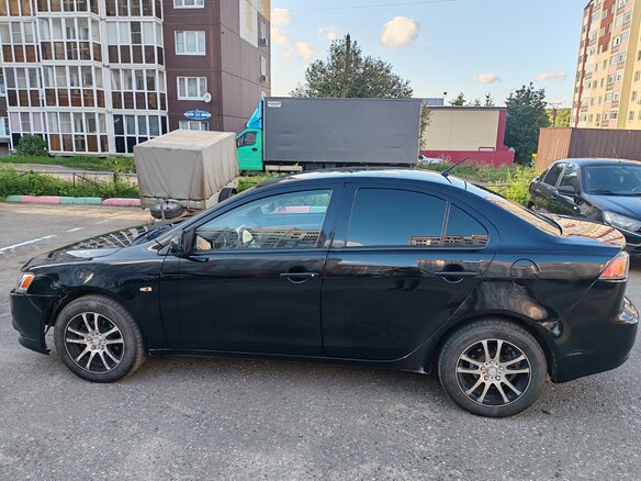2010 Mitsubishi Lancer X, чёрный, 620000 рублей - вид 3