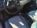 2010 Chevrolet Aveo I Рестайлинг, красный, 430000 рублей - вид 3