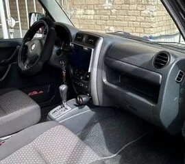 2011 Suzuki Jimny III Рестайлинг 1, чёрный, 850000 рублей, вид 3