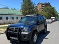 2010 Nissan Xterra II Рестайлинг, синий - вид 1