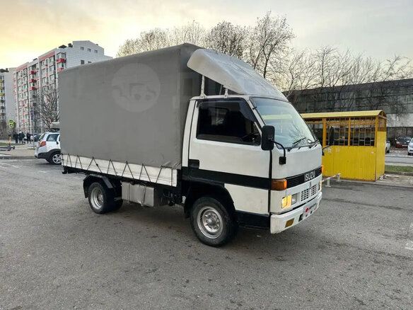 1987 Isuzu Elf (N-series), белый, 600000 рублей - вид 1