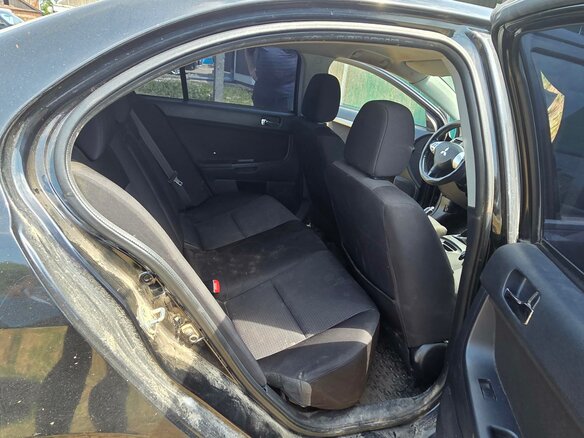 2010 Mitsubishi Lancer X, чёрный, 414000 рублей - вид 15